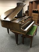 A mahogany cased baby grand piano by Kirkman of London, width 140 cm, with duet stool.