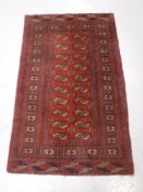 A fringed Bokhara design rug,
