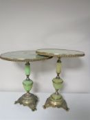 A pair of brass and onyx effect lamp tables