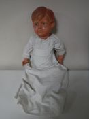 A mid 20th century plastic headed doll