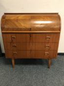 A teak cylinder bureau,