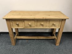 A reclaimed pine kitchen preparation table, fitted with four drawers, 124 cm wide.