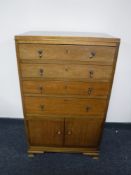 A mahogany four drawer cutlery chest fitted cupboards beneath