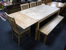 A contemporary oak dining table with two extension leaves,