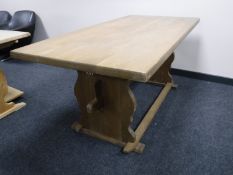 A blonde oak refectory dining table,
