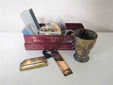 A box containing sterling silver napkin rings, crowns, pen nibs, plated tankard, bookmark,