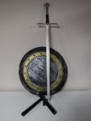 A set of Way of the Warrior nunchuks together with a decorative shield and sword