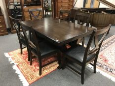 A contemporary hardwood extending dining table on x-frame, length 157 cm,