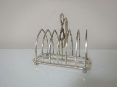 A silver seven-bar toast rack, Thomas Bradbury and Sons,