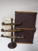 An early 20th century wooden bound travelling trunk together with a six-way wooden candelabra and