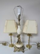 A brass cherub table lamp,
