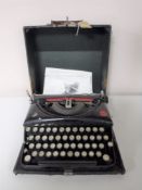 A cased mid 20th century Mead typewriter