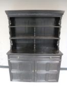 An oak ebonised kitchen dresser