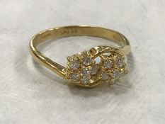 An 18ct gold double cluster ring