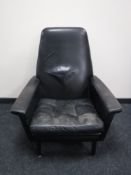 A mid twentieth century black leather high backed armchair