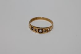 An 18ct gold pearl and diamond ring, size P, 2.3g.