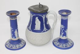 A pair of 19th century Wedgwood Jasperware candlesticks (a/f) together with a Jasperware basket