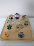 A collection of eleven glass paperweights
