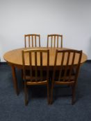 A mid twentieth century oval teak extending dining table,