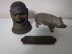 A cast iron salted peanuts money box together with a Quaker City Hams money box and a lady's door