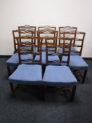A set of eight early twentieth century mahogany ladder back dining chairs