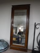 A continental walnut framed hall mirror