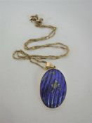 A gold mounted lapis lazuli pendant on chain