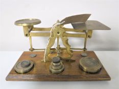 A set of brass postal scales