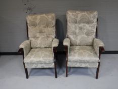 A pair of button back fire side chairs