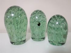 A set of three Victorian green glass dumps