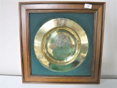 A framed brass Masonic plaque