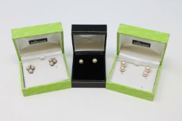 Three pairs of pearl earrings set in gold, one 18ct.