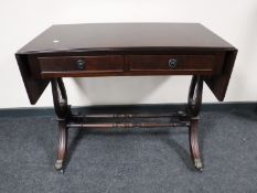 An inlaid mahogany sofa table fitted two drawers