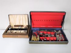 Three canteens containing assorted flatware,