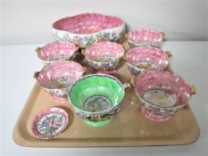 A tray containing a Maling Rosine lustre bowl together with seven Maling grapefruit dishes and a