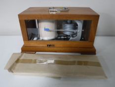 A contemporary mahogany cased barograph with charts