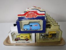 A tray containing thirty boxed diecast vehicles including Pepsi, News of the World,