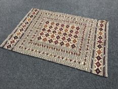 An Eastern carpet with geometric design,