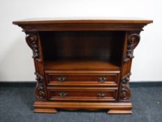 A carved reproduction audio stand