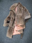 A fur coat and fur stole
