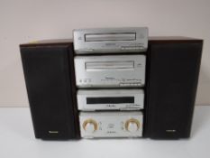 A Technics 4 piece micro Hi-Fi stack and speakers
