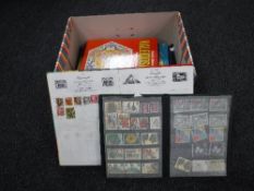 A box containing assorted stamp albums and stamps