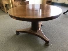 A circular Victorian mahogany breakfast table