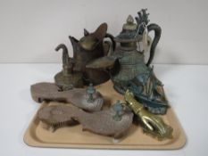 A tray containing Eastern metal tea pots, a brass oil can, a bronze figure of a Viking long ship,