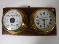 A brass ships style barometer and clock,