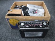 A box of transistor radios including Roberts and Hacker, cassette tapes,