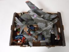 A box containing three large scale plastic military aircraft,