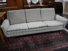 A mid 20th century Danish settee in checked fabric