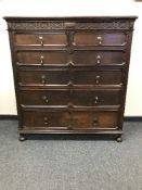 An Edwardian oak six drawer,