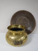 A large antique copper bowl,